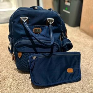 Modern navy blue diaper bag with changing pad and pacifier case